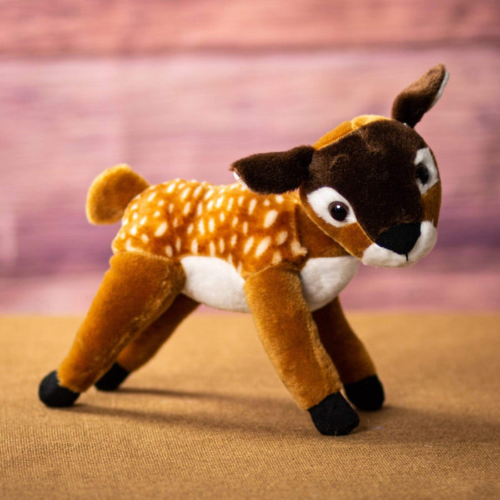 A standing fawn that is 10 inch from head to tail