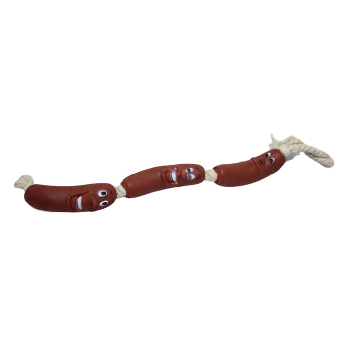 Three red sausage-shaped toys with faces connected by a beige rope, designed for dog play and tugging.