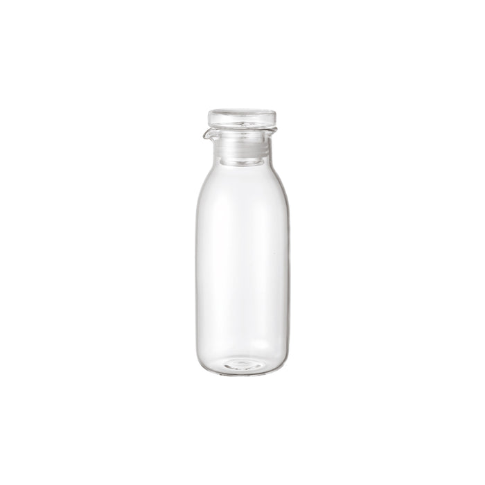 Clear glass bottle on a white background