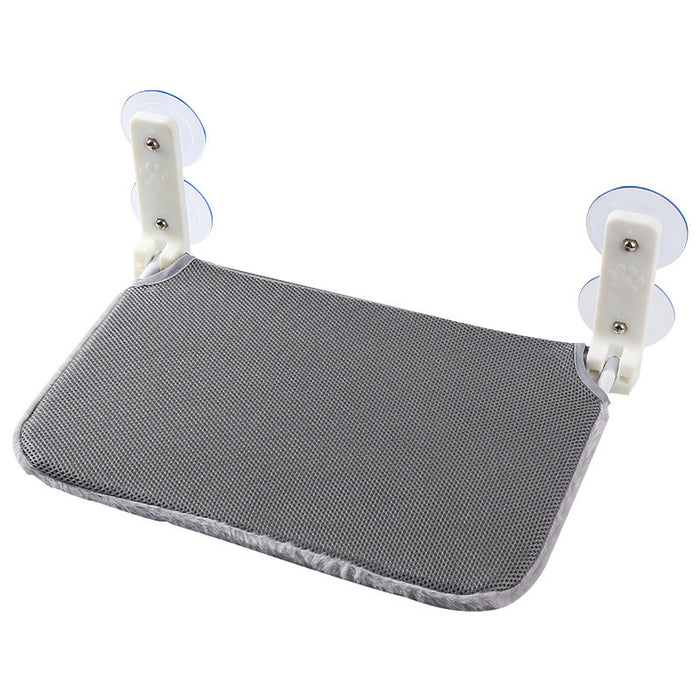 Cordless folding cat window hammock in gray fabric with white suction cup mounts for easy attachment.