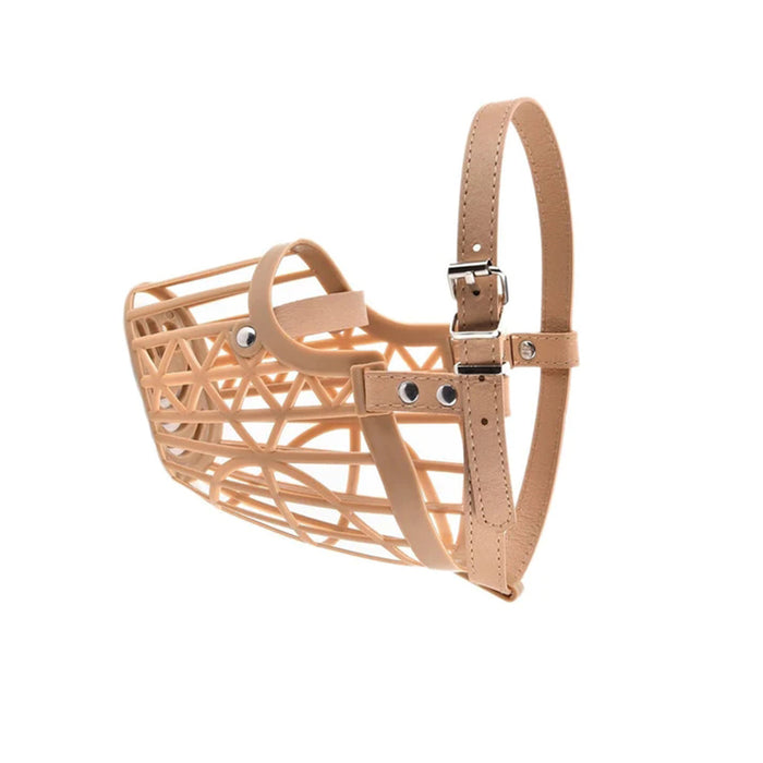 A tan dog muzzle made of flexible plastic with a geometric design and an adjustable leather strap.