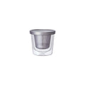 Clear glass mug with metal lid on a white background
