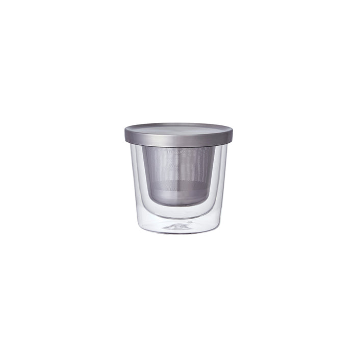Clear glass mug with metal lid on a white background