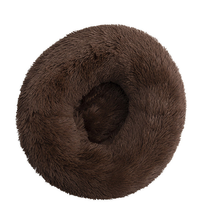 Soft, plush, round pet bed in a rich brown color, featuring a fluffy exterior and cozy center for pets to snuggle.