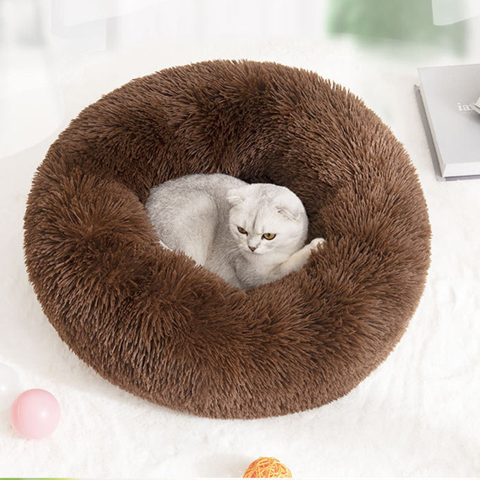 Cozy brown plush round pet bed with a soft fur texture and a gray cat lounging comfortably inside.