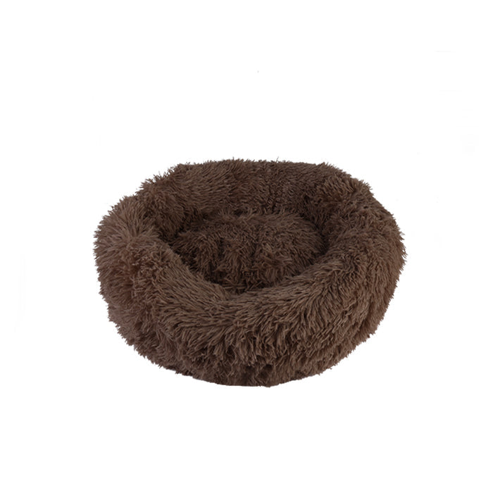 Soft, round pet bed in rich brown plush material, featuring raised edges for added comfort.