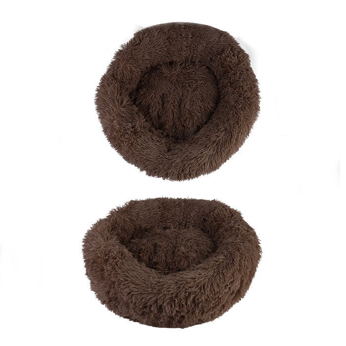 Soft, plush round pet bed in rich brown color, featuring a shaggy fur-like texture for comfort and style.