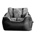 Cozy black pet car booster seat with plush gray interior and adjustable straps for safety.