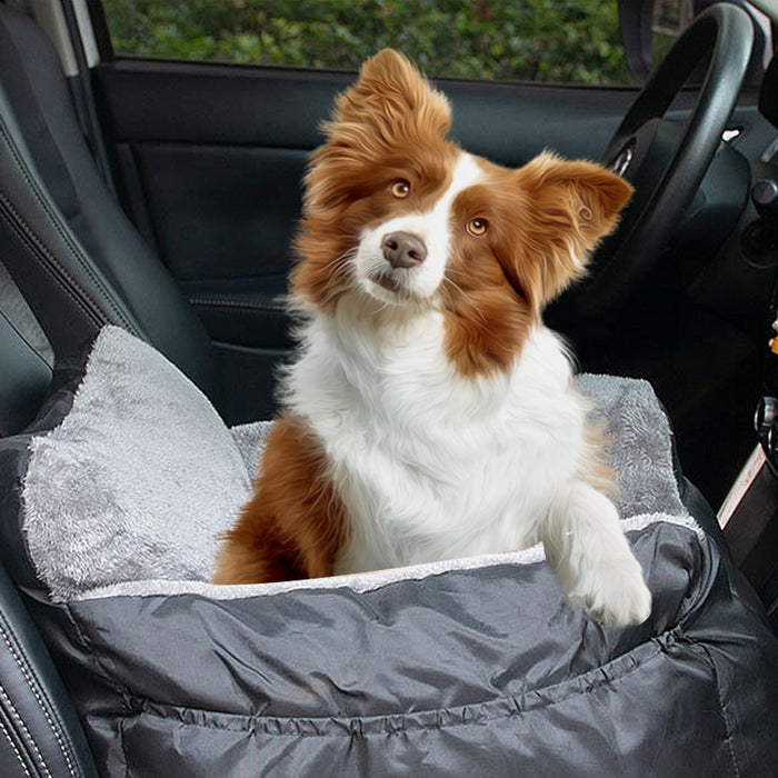 A soft gray booster seat for pets, shown in a car with a happy dog comfortably resting in it.