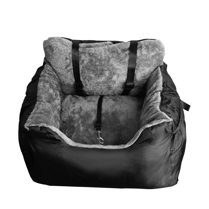 Cozy black pet car booster seat with a soft gray fleece interior and safety harness straps for secure travel.