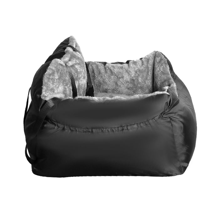 A black plush travel companion pet car booster seat with a soft grey interior and adjustable straps is displayed.