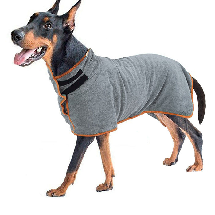 Gray microfiber dog bathrobe with orange trim, shown on a happy dog standing upright against a white background.