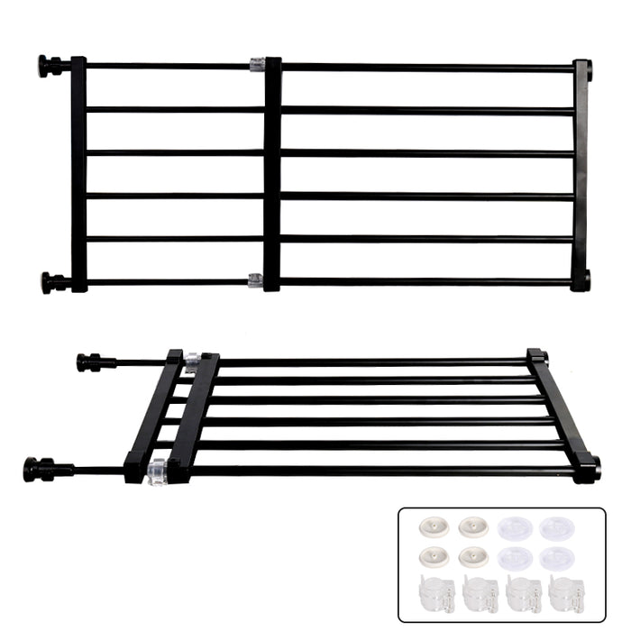 Retractable black pet safety gate displayed flat with installation hardware in a corner.