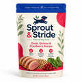Colorful packaging of Sprout & Stride Duck, Quinoa & Cranberry dog food with sliced duck and quinoa displayed.
